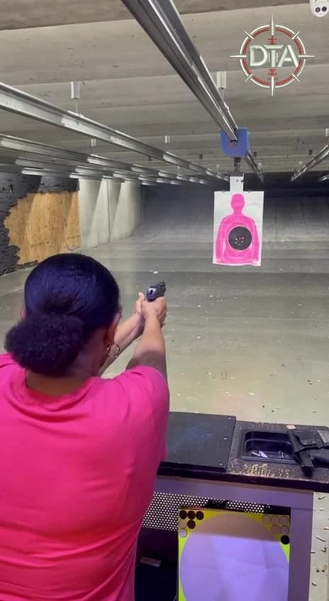 Woman practicing pistol fundamentals with Down-Range Training Academy in Kennesaw, GA — Heels & Holsters women-only class